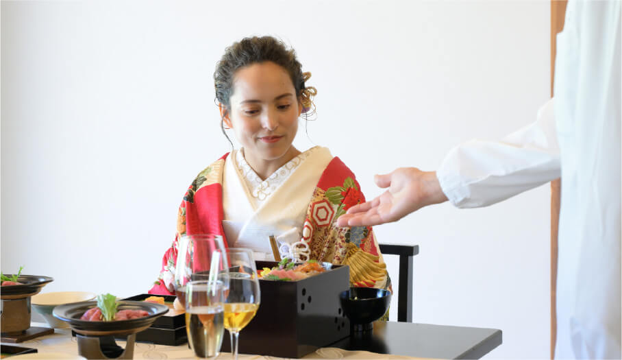 A woman listening to an explanation of Japanese cuisine