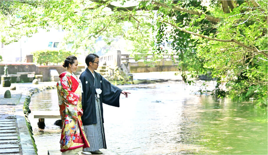 Dressed in kimono, they admire the glimmering river