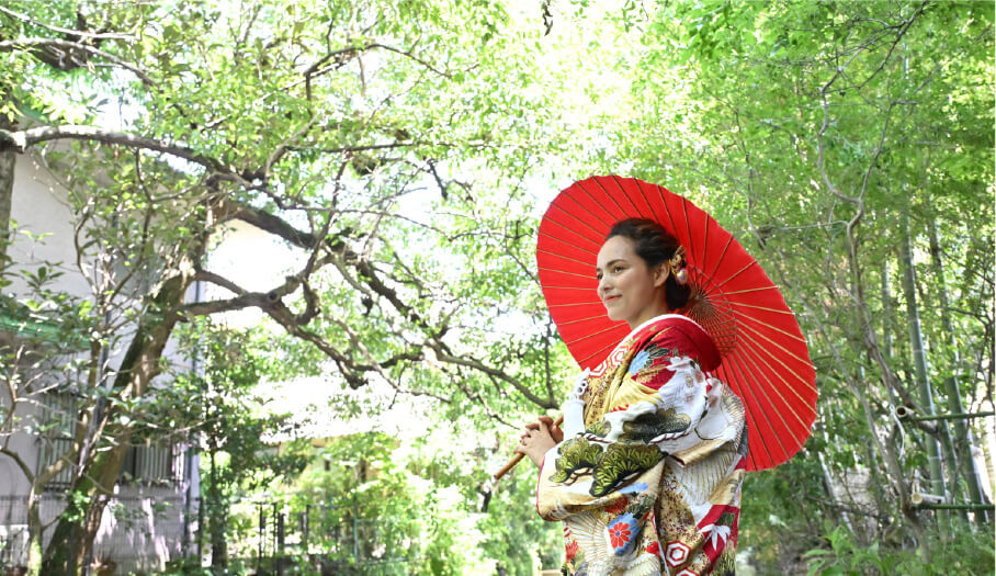 A beautiful woman in kimono standing in green