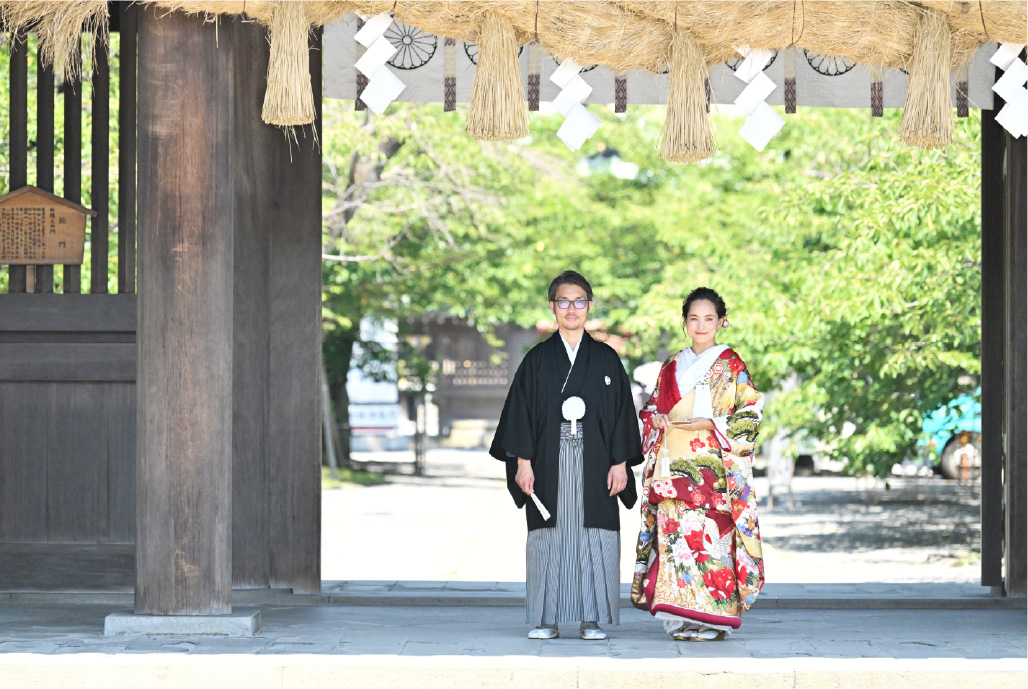 Historic buildings surround the couple at Mishima Grand Shrine